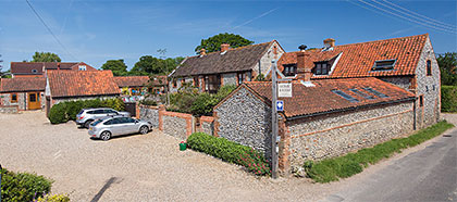 Entrance to Home Farm Holiday Cottages from Holt Road looking NNW
